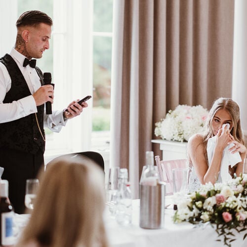 Düğün fotoğrafı: man giving wedding speech, bride wiping tears, elegant reception table, white floral centerpiece, bright natural light | James Hatter, London, Birleşik Krallık
